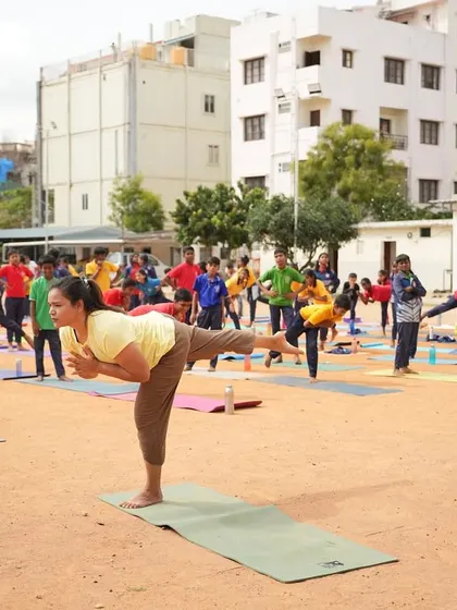 Leading the students in Virabhadrasana III (Warrior III), a pose that challenges balance and focus.