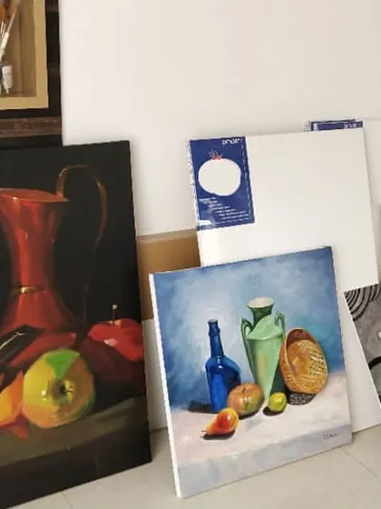 This is a corner of my studio, filled with a few of my completed paintings and blank canvases ready for new ideas. I'm obsessed with this wall!