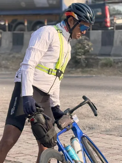 A rider taking a moment to stretch during a long BRM. Ultra-distance cycling is a battle of mind and body.