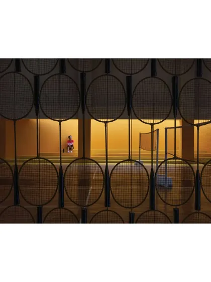 A creative screen made of badminton rackets separates the viewing gallery from the court at the Meraki Clubhouse. This playful detail is an example of how we like to incorporate thematic elements directly into our architectural design.