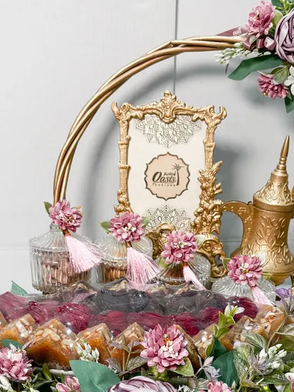 This is one of the hamper designs that won me the "Best Packaging" award. A beautiful, ornate ring tray decorated with flowers, it’s a perfect example of how I blend gifting with decor.