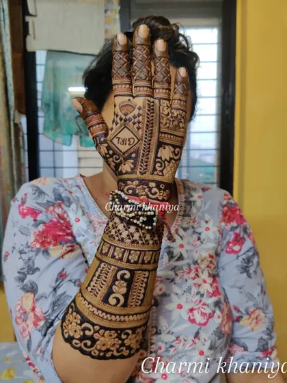A close-up of the baby shower mehendi, showing the "GIRL" motif. It's a fun way to celebrate the upcoming arrival.