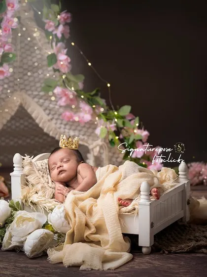 A duplicate of image 32, showcasing the full, enchanting setup of the floral teepee and royal cot.