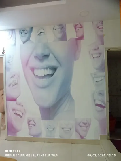 A custom mural for a dental clinic waiting area, featuring a collage of smiling faces. This is an example of how I cater to specific commercial needs.