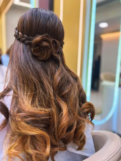 A hairstyle that's pure art. We created this beautiful look by combining a soft balayage for dimension with an intricate rose braid, perfect for a special occasion or when you just want to feel amazing.