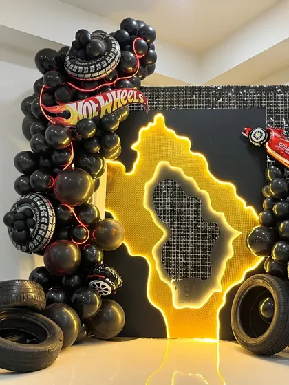 A slightly different angle of the Hot Wheels decor, showing the texture of the sequin backdrop.