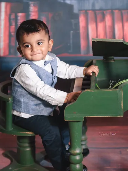 A gallery of our popular school and library theme. These images show the versatility of the brick wall backdrop, mini school desk, globe, and book props for creating a variety of scholarly and classic portraits.