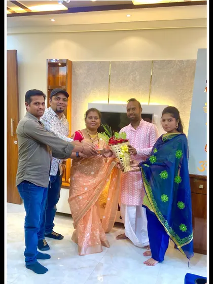 My team and I presenting a bouquet to our clients in Ambernath. This gesture marks the successful completion and handover of their 2BHK interior project.