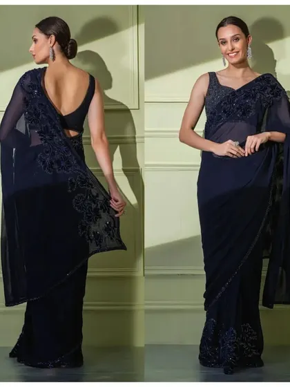 The full front and back view of the navy georgette saree, showcasing its graceful drape and the elegant deep-back blouse.