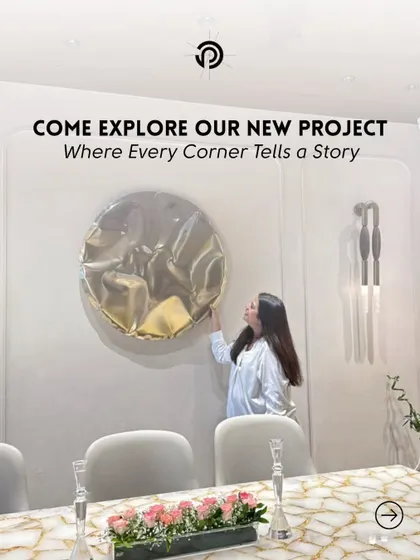 Here I am, adding the final touches to the dining area at The Aura House. That last piece of art or decor is what makes a space feel complete and truly personal.