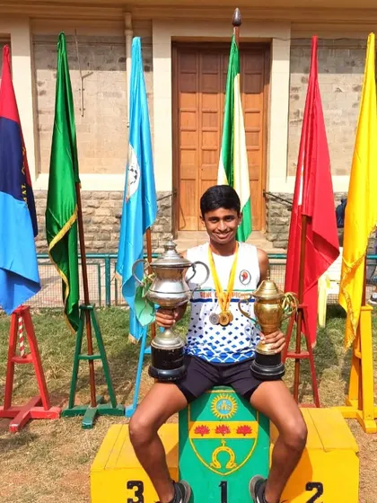 Jordan with his trophies after being named the senior athletic champion.