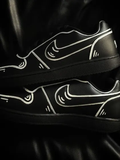A pair shot of the cartoon-style Nike Ebernons.