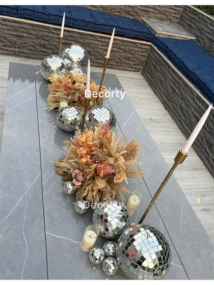 Another view of the stunning disco ball table runner, a unique and memorable decor choice for a modern party.