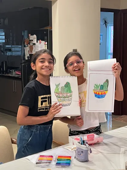 The best friends duo, so happy with their finished succulent drawings! Sharing their creations with a smile is the best part of class.