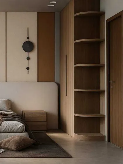 On the other side of the bed, a curved, open shelving unit is built into the wardrobe, providing a beautiful display space while softening the corner of the room.