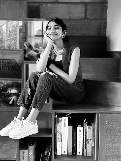 This is Radha, our dancing queen with eyeliner that's always on point. She's a floating hard worker with a knack for singing and sketching.