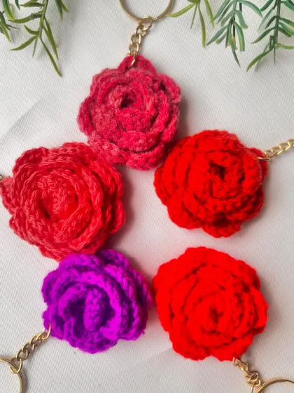 A collection of colorful rose keyrings. These small handmade items are packed with charm and make for a thoughtful gift.