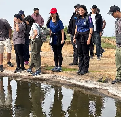 Taking a moment to look at the small pond at the top of Kaiwara Hills. It's the little discoveries that make a trek special.