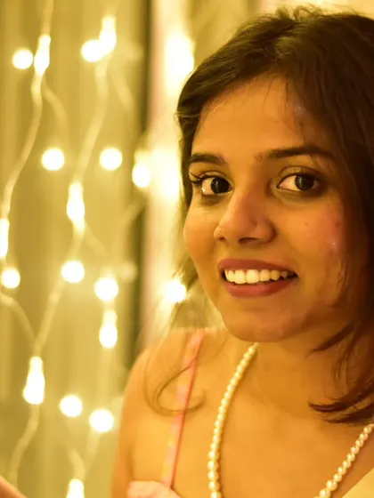 A festive look for Diwali. The warm glow of the lights complements the soft colors of my saree and pearl necklace.