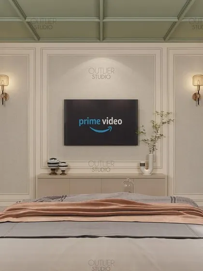 A view of the media wall in the green and beige bedroom. The design features simple wall paneling and a minimalist console, keeping the focus on the serene and calming color palette.