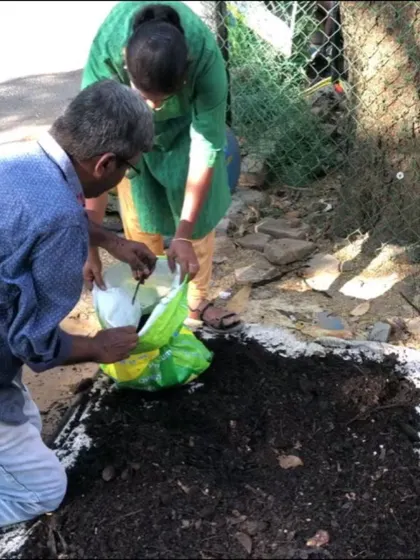Teamwork makes the dream work. Here, volunteers are bagging the finished compost from a community project. This nutrient-rich soil amendment will now go on to nourish local gardens and farms.