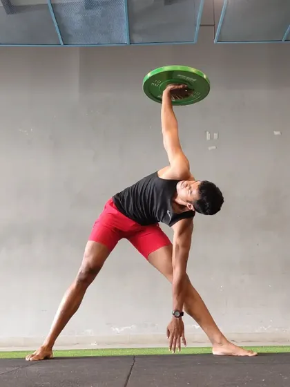 This is control. A weighted windmill is an advanced exercise that challenges shoulder stability, thoracic mobility, and core strength all at once. This is how you build a body that is strong in every direction.