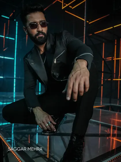 A powerful shot of Vicky Kaushal in my bespoke couture from the "Tauba Tauba" music video. The all-black look, sharp tailoring, and dramatic lighting all contribute to the commanding presence required for the screen.