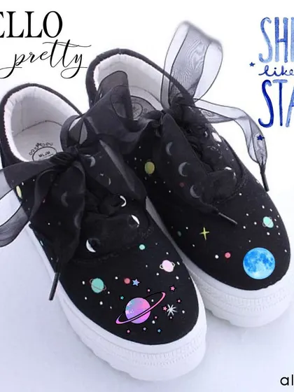 I painted these black canvas shoes with a celestial galaxy theme, complete with planets, stars, and moons. The organza ribbon laces add a final dreamy touch to the design.