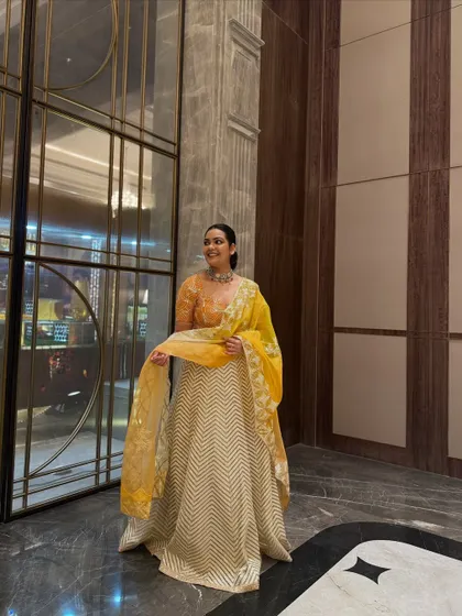 The full ensemble, showcasing the beautiful flare of the chevron lehenga skirt. A perfect blend of modern design and traditional craftsmanship.