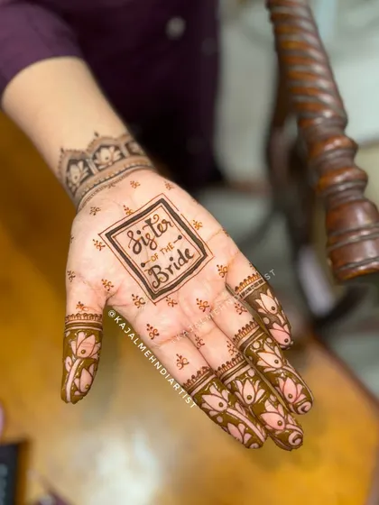 A close up of the "Sister of the Bride" henna, a fun and personal touch.