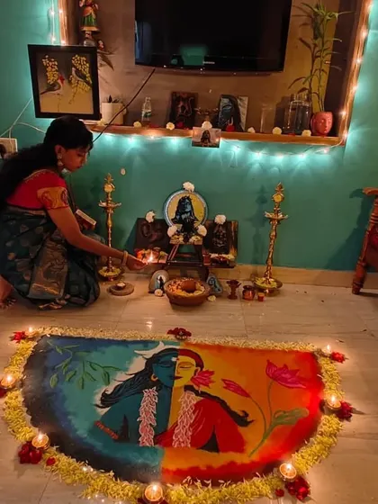 Lighting the lamps around my Mahashivratri rangoli and home shrine.