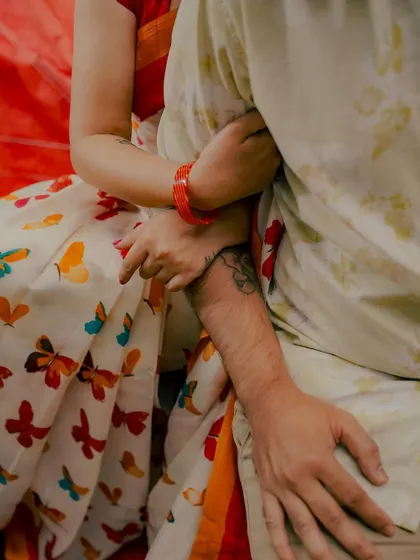 A detail shot focusing on the couple's hands and the bride's beautiful butterfly-print saree. I believe in capturing the small details that add to the overall story of the day.