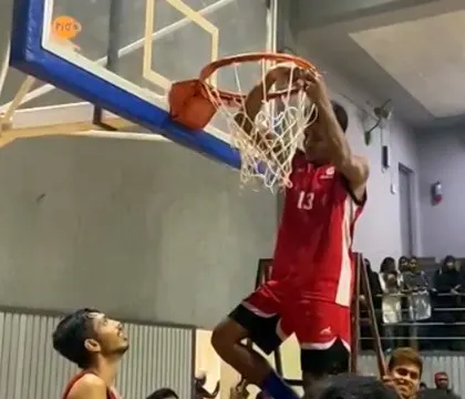 A teammate throwing down a dunk.