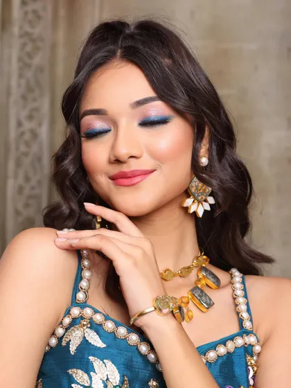 A serene close-up of the blue eyeshadow. This shot highlights your technical skill in blending and application.