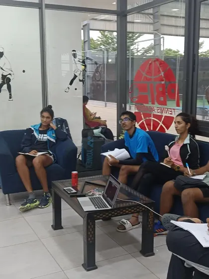 Our players in a classroom session, focusing on the mental aspects of the game. We believe that understanding strategy and psychology off the court leads to better performance on it.