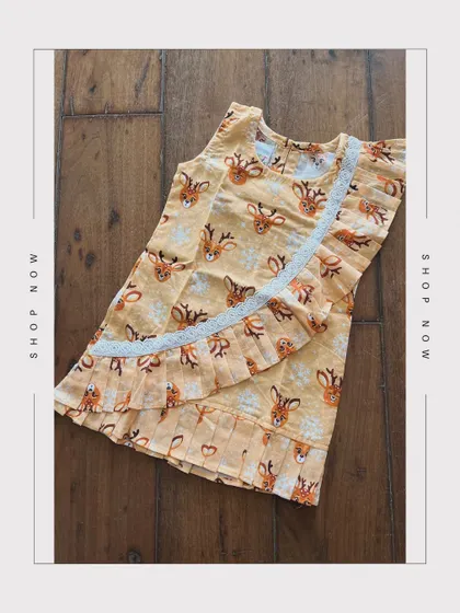 Embrace the charm of nature with our Small Deer Printed Dress. Adorned with pleat detailing and delicate white lace, it’s a cotton dream come true.