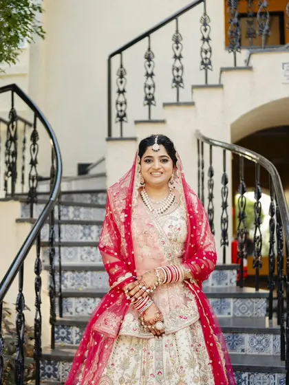 Another angle of this beautiful bride. The maang tikka and jewelry are perfectly balanced with the soft makeup and hairstyle.