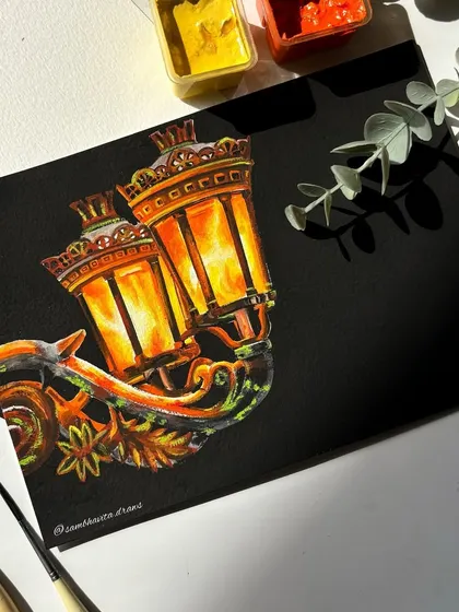 An intricate painting of a vintage-style lantern glowing in the dark. I used gouache on black paper to make the light feel warm and inviting.