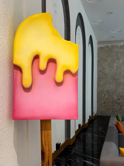 A giant melting popsicle prop used in our Candyland baby shower theme. These custom props are what make a themed party truly immersive.