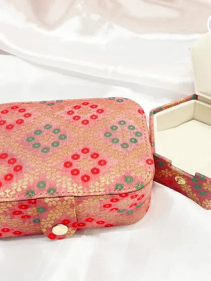 A customizable jewelry box in a traditional bandhani print, perfect for storing small trinkets.