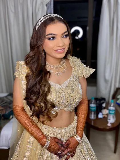 A happy and radiant bride-to-be. This look features a classic soft glam eye, flawless skin, and a glossy lip, perfect for a night of dancing and celebration.