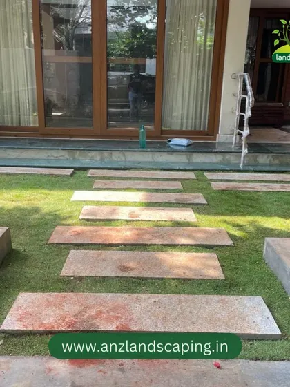 Looking back towards the house, this view shows the clean lines of the pathway and how the new lawn enhances the home's entrance.