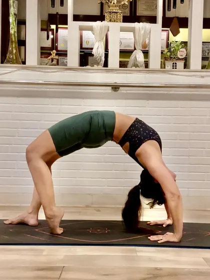Urdhva Dhanurasana, or Wheel Pose, is a deep backbend that opens the entire front body. It teaches us that life, like a half-circle, has bends and challenges that we can meet with grace.