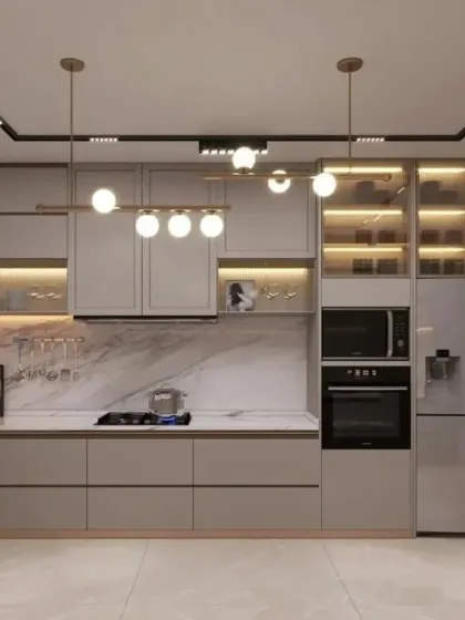 We designed this kitchen with smart, high-tech appliances, including a smart refrigerator. The grey cabinets and marble backsplash create a sleek and modern backdrop for the latest in kitchen technology.