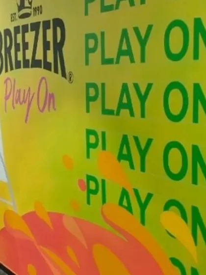 This section of the Breezer mural features bold typography with the "Play On" slogan, reinforcing the brand's message in a visually exciting way.