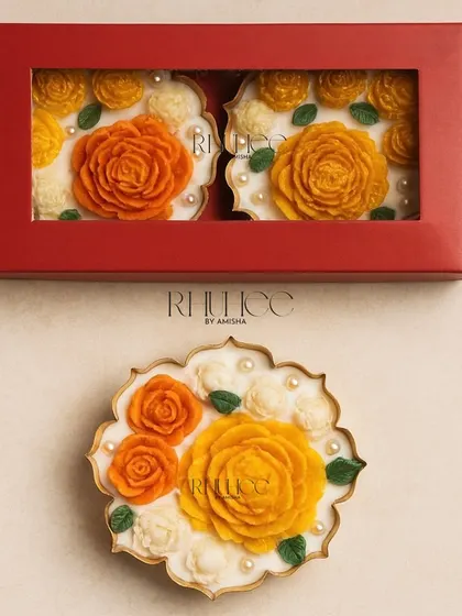 The Genda Deep Set, featuring two of my floral urlis in a beautiful red gift box. This is a perfect festive gift set that adds a pop of color to any space.