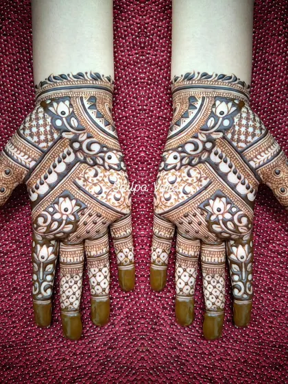 A beautiful symmetrical design with lotus flowers and geometric bands.