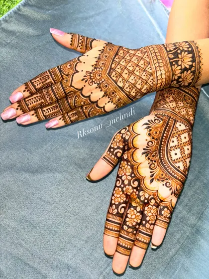 A beautiful and clean bridal design featuring geometric check patterns and delicate floral work. The symmetrical layout on both hands creates a look of perfect harmony and elegance.