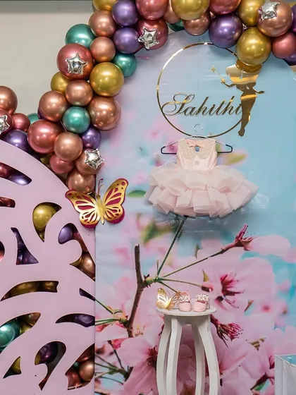 The joy on the faces of these two cutie pies made all the last-minute changes due to rain completely worth it. This fairy-themed party featured a beautiful custom backdrop with their first dress and shoes on display.