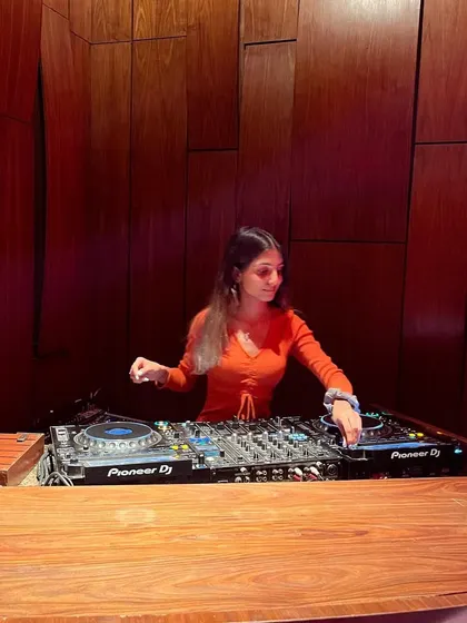 A final shot from my techno set at the Taj, showing my complete focus on the Pioneer DJ decks.